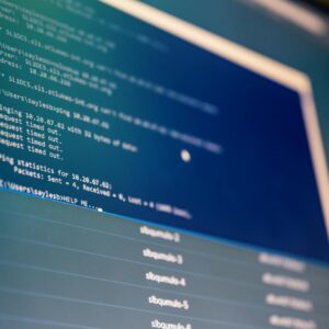 Close-up of digital data analysis displayed on a computer monitor with blue tones.