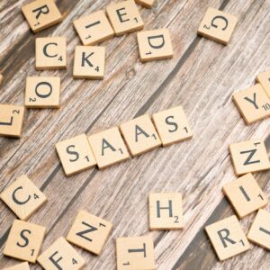 Wooden letter tiles spelling SaaS on rustic wood. Ideal for cloud computing and business concepts.